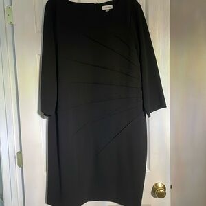 Black Calvin Klein Dress, front design pleats,hidden back zipper,3/4 sleeves.